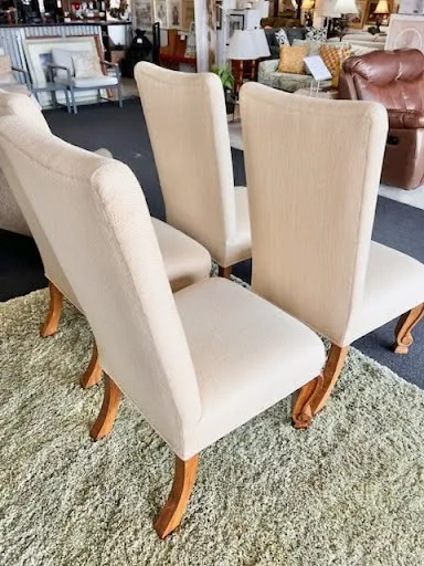 Beige upholstered armless dining chair