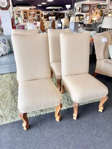 Beige upholstered armless dining chair